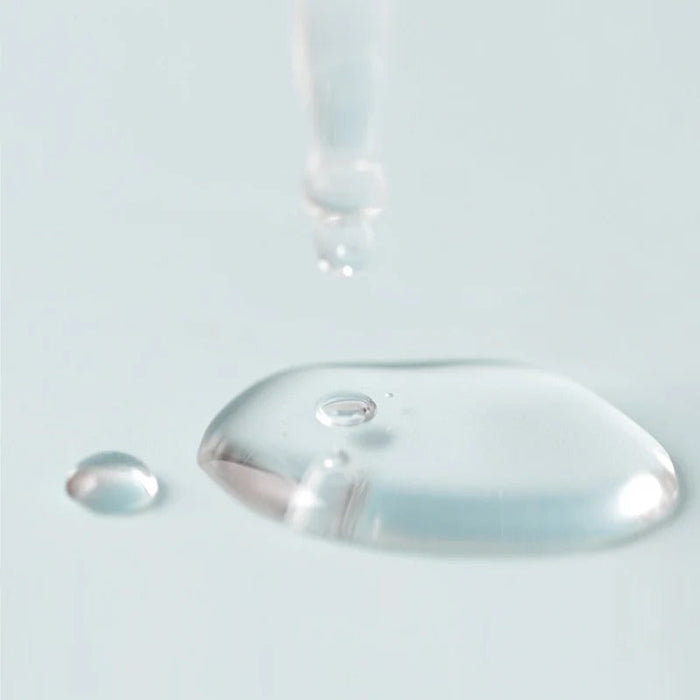 Close-up of JUMISO D-Panthenol Barrier Soothing Serum 70ml texture with liquid dropper, showcasing its hydrating formula.