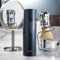 LACVERT Homme Recharge All-in-One Essence 150ml bottle styled on marble counter with shaving brush and mirror — Gentleman Korea