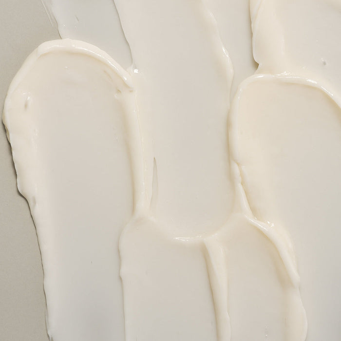 Texture of LADOR Herbalism Treatment 150ml displayed on a surface highlighting creamy consistency.