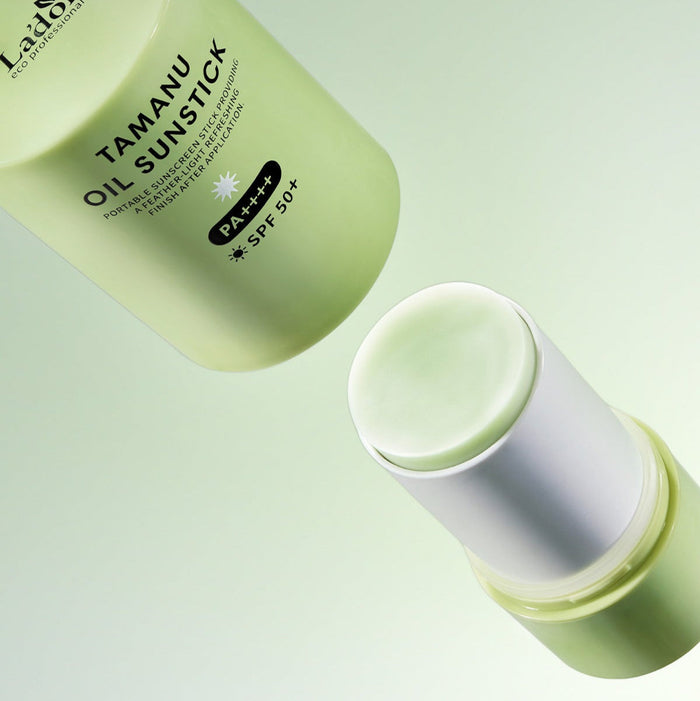 LADOR Tamanu Oil Sun Stick 21g, luxury skincare with SPF 50 protection, green stick design.