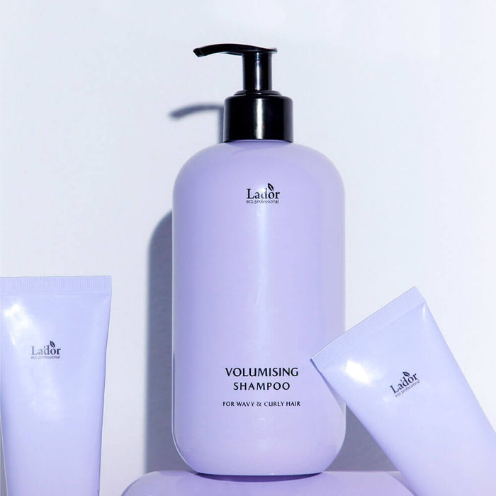 LADOR Volumizing Curl Shampoo 530ml bottle displayed with additional hair care products.