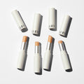 LUNA Pro Perfecting Stick Concealer collection with sleek white packaging and various nude shades for flawless makeup application.