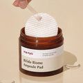 MANYO Bifida Biome Ampoule Pad 70 Sheets in jar, skincare product on beige background