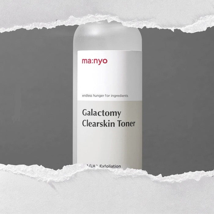 MA:NYO Galactomy Clearskin Toner 210ml bottle on torn paper background.
