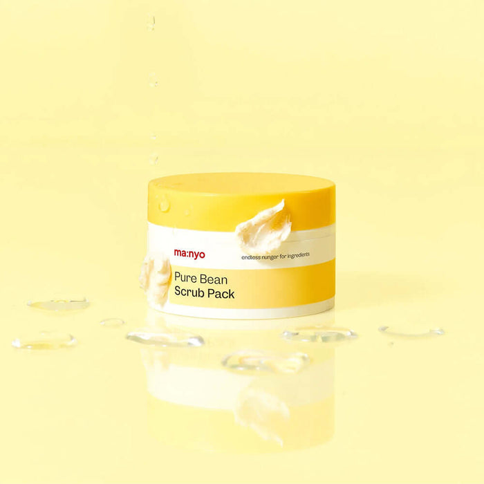 MANYO Pure Bean Scrub Pack 100ml jar with creamy texture on a yellow background