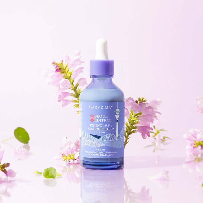 MARY & MAY Retinol 0.1% Bakuchiol Cica Serum 80ml with flower background