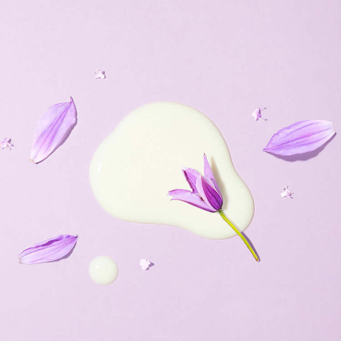 MARY & MAY Retinol 0.1% Bakuchiol Cica Serum 80ml with delicate purple flower on lilac background