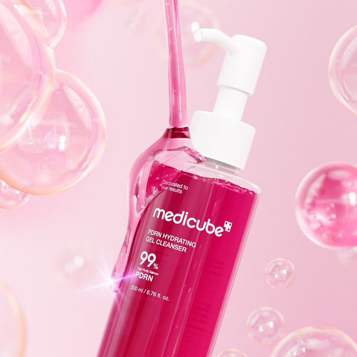 MEDICUBE PDRN Gel-To-Foam Cleanser 200ml bottle with bubbles and pink background.
