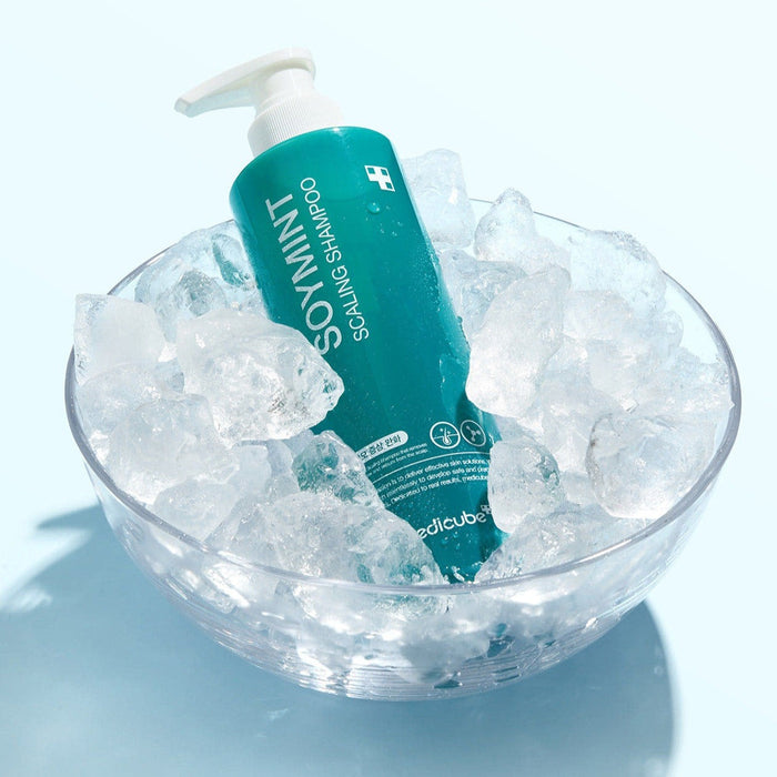 MEDICUBE Soymint Scaling Shampoo 490ml in a bowl of ice, showcasing cool and refreshing design.