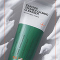 MEDIHEAL Tea Tree Cleanser 120ml packaging, close-up view with calming effects and moisturizing benefits visuals.