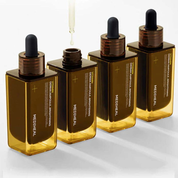 Four bottles of MEDIHEAL Vitamin Derma Ampoule Blemish Whitening 50ml with droppers, showcasing the skin whitening serum.