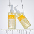 MEDIPEEL Vegan Vitamin Deep Tox Cleansing Oil 200ml displayed with two bottles and oil dripping, highlighting skincare benefits.