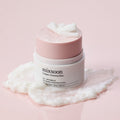 MIXSOON Collagen Cleansing Balm 50ml product on a smooth surface with creamy texture, emphasizing skincare and beauty.