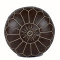 Brown leather pouf with geometric pattern on a white background