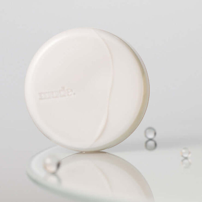 MUDE Soft Silky Fit Cushion in elegant packaging on reflective surface
