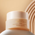 NATURE REPUBLIC Snail Solution Cream 52ml jar on a beige background showcasing the bottle design.