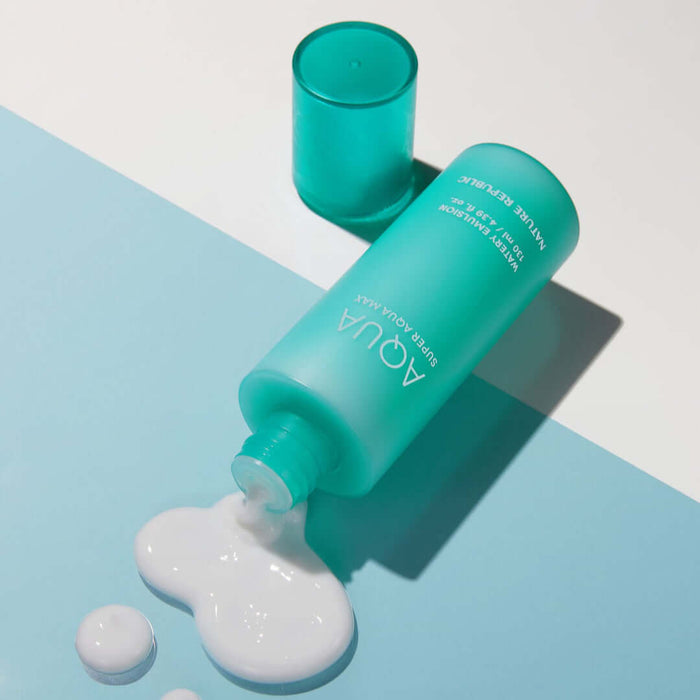 NATURE REPUBLIC Super Aqua Max Watery Emulsion 130ml bottle spilling on blue surface
