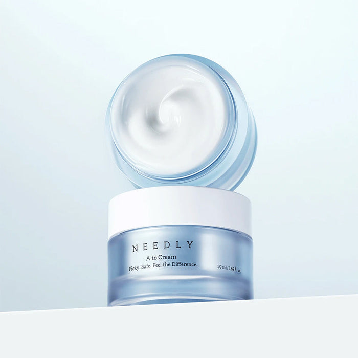 NEEDLY A to Cream 50ml jar showing creamy texture. Skincare product for effective moisturizing.