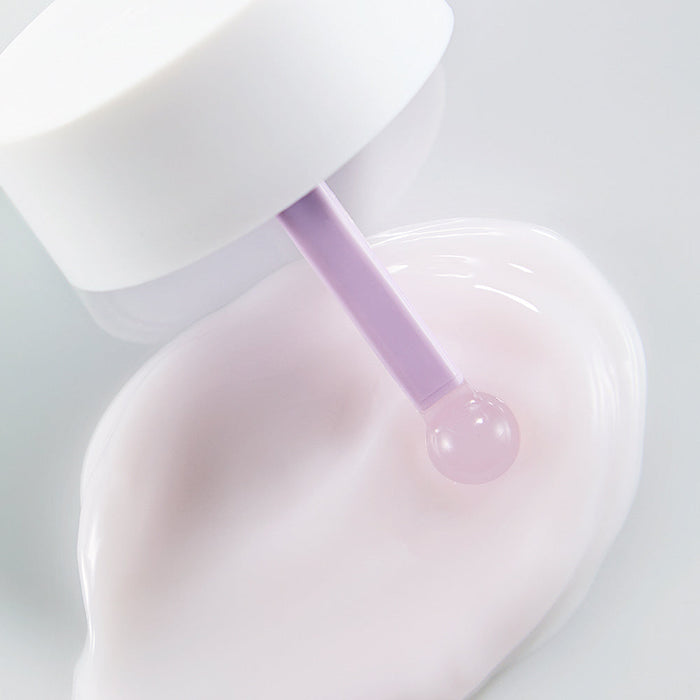 Close-up view of NEOGEN V Biome Soothing Cream 60g with a lavender applicator and cream texture on white background.