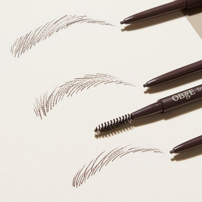 OBGE Easy Pencil Bro eyebrow pencil and spoolie set on paper with brown eyebrow strokes — Gentleman Korea Korean men’s grooming product