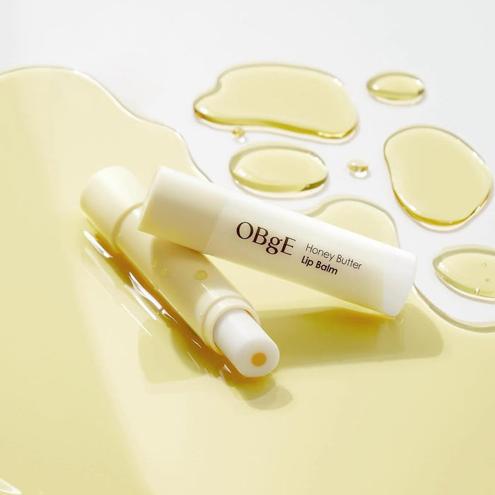 OBGE Honey Butter Lip Balm on glossy honey background – Gentleman Korea Korean skincare for men