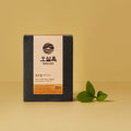 OSULLOC Green Oolong Tea 10p package with tea leaves on beige background