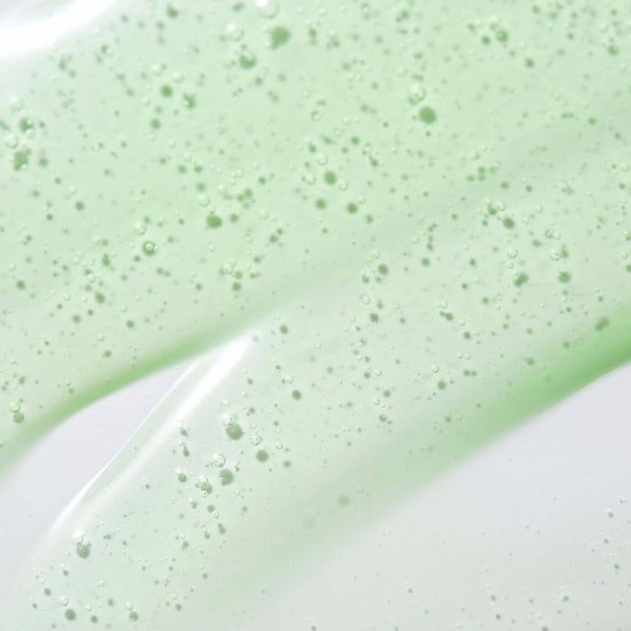 Texture of PARNELL Panthenol 5.78 Heartleaf Calming serum 30ml with visible bubbles on a green background
