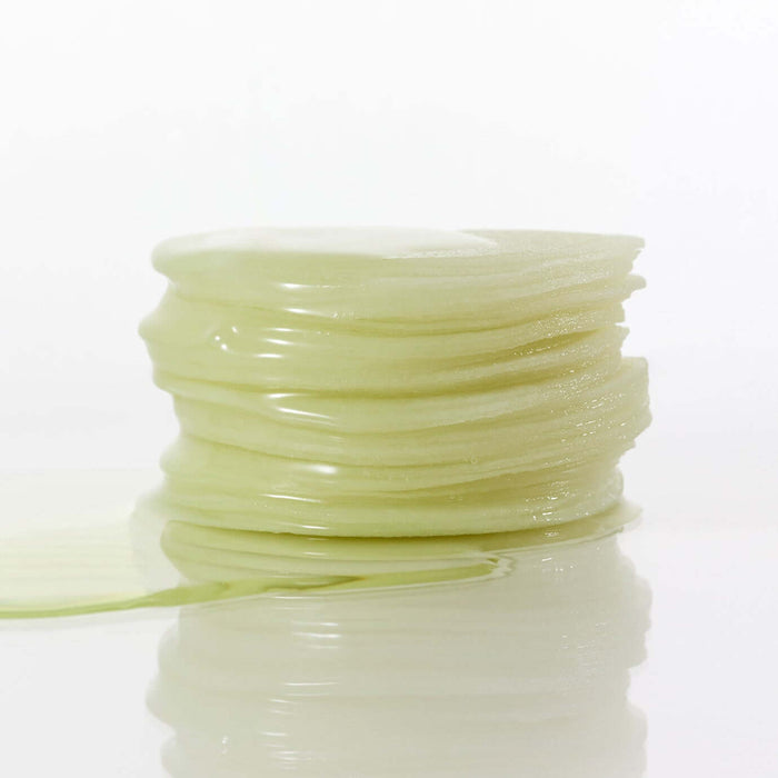 Stack of soothing PARNELL Panthenol Heartleaf Calming Pad 60pads on a reflective surface