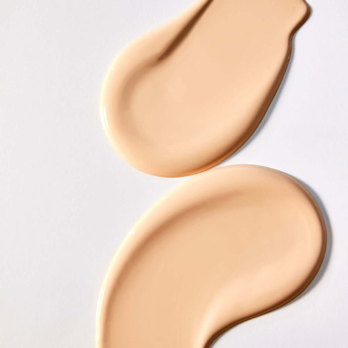 Texture swatch of PARNELL Serum In High Glow Cushion 15g showing creamy beige liquid on white background.