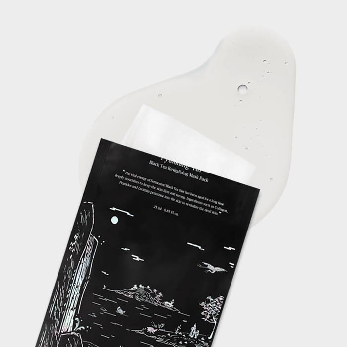 PYUNKANG YUL Black Tea Revitalizing Mask Pack 10 Pieces laying on a white surface with design details visible.