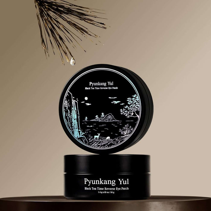 PYUNKANG YUL Black Tea Time Reverse Eye Patch 60 Sheets in elegant packaging on a pedestal