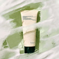 PYUNKANG YUL Calming Acne Cleansing Foam 100ml against a foamy green backdrop