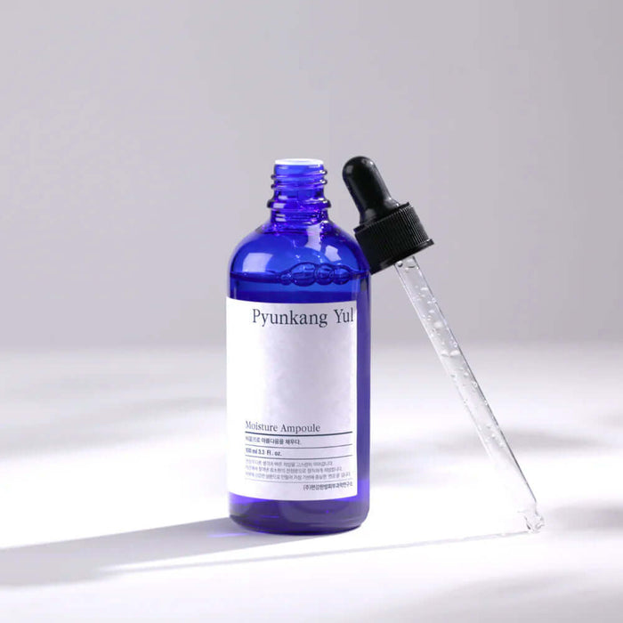 PYUNKANG YUL Moisture Ampoule 100ml with blue bottle and dropper for hydrating skincare.