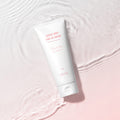 RIRE Lucent White Tone-Up Cream showcased on a soft pink water ripple background.