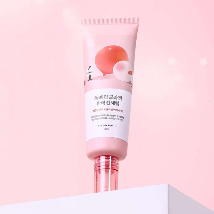 ROUND LAB Dongbaek Deep Collagen Elasticity Sun Serum 50ml, pink design bottle on a soft pink background.