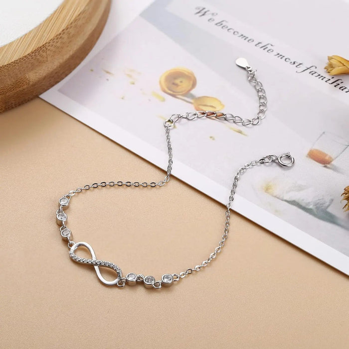 Silver-tone infinity bracelet with cubic zirconia accents - BELARIC