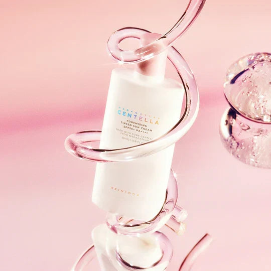 SKIN1004 Madagascar Centella Poreizing Velvet Finish Sunscreen 50ml displayed in a pink background with a decorative design.
