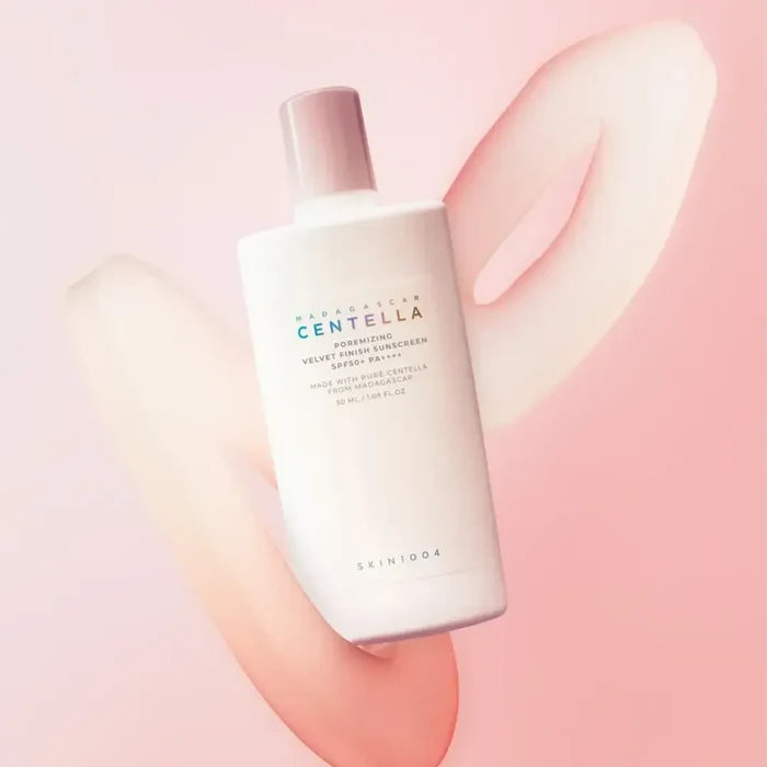 SKIN1004 Madagascar Centella Poreizing Velvet Finish Sunscreen 50ml bottle on a pink background