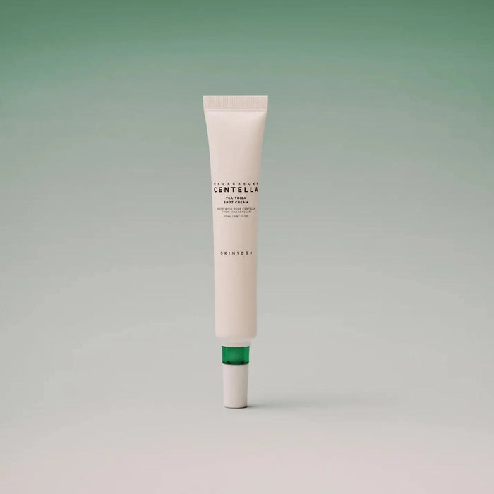 SKIN1004 Madagascar Centella Tea-trica Spot Cream 20ml tube on a green gradient background