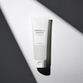 SKIN1004 Madagascar Centella Tone Brightening Cleansing Gel Foam 125ml on a stylish black and white background.