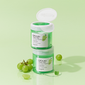 Two SKINFOOD CICA BHA Toner Pad containers with green grapes and mint leaves on a light green background.