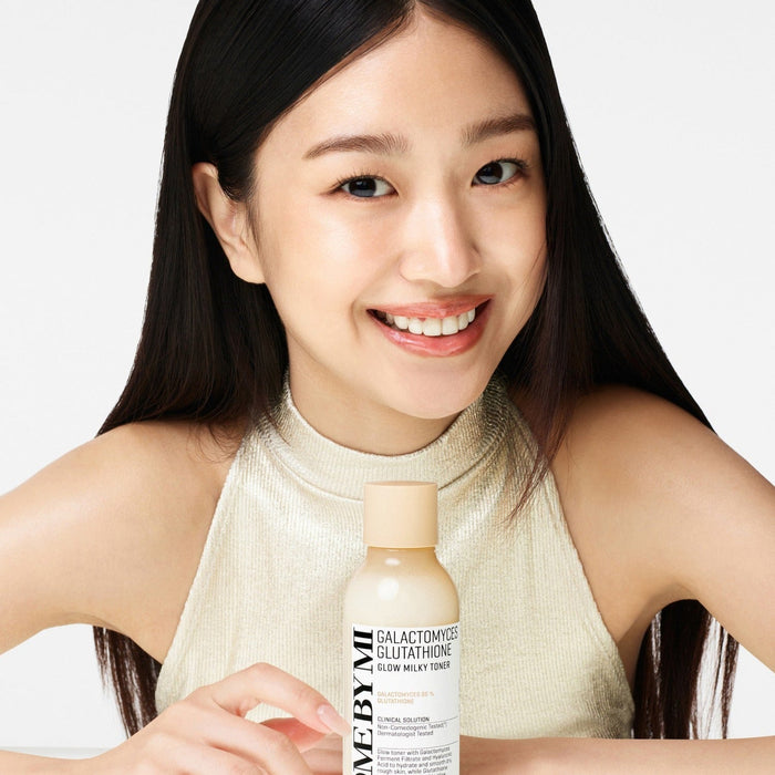 SOME BY MI Galactomyces Glutatione Glow Milky Toner 200ml held by smiling woman in creamy top