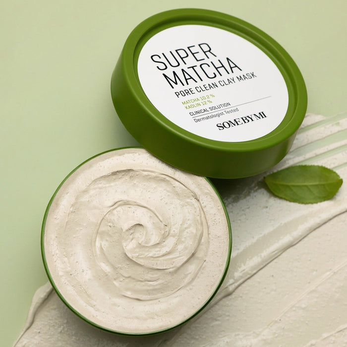 SOME BY MI Super Matcha Pore Clean Clay Mask 100g shown with open lid displaying creamy texture on a green background.