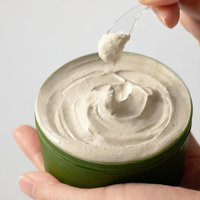 SOME BY MI Super Matcha Pore Clean Clay Mask 100g in jar with a dollop on spatula, showcasing creamy texture for pore care.