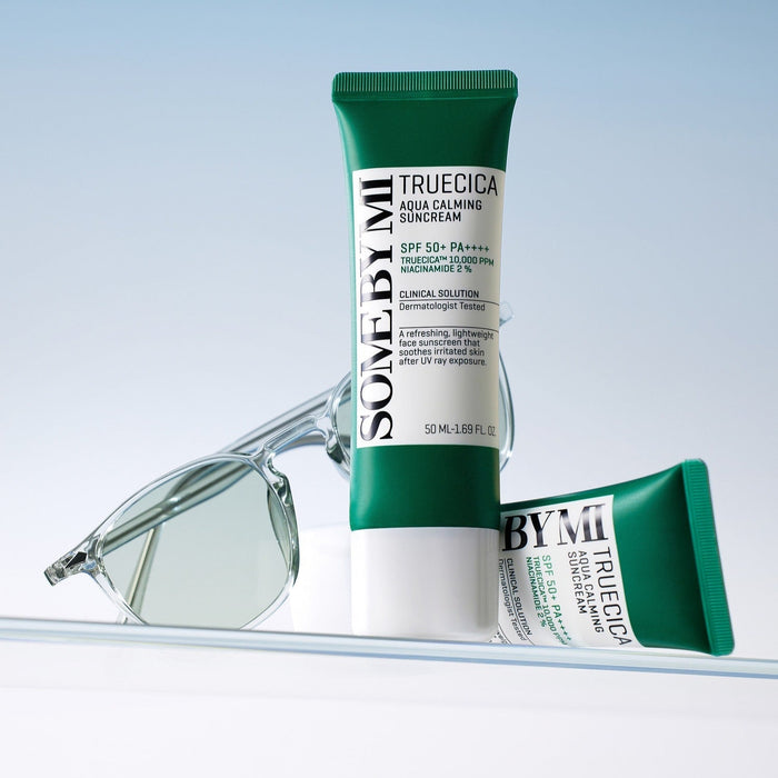 SOME BY MI Truecica Aqua Calming Sun Cream 50ml with sunglasses, SPF 50+, soothing skincare product for sun protection.