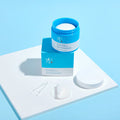 SOORYEHAN Moiture Spring Hyaluronic Ampoule Pads 70 Sheets displayed on a blue background with packaging and pads visible.
