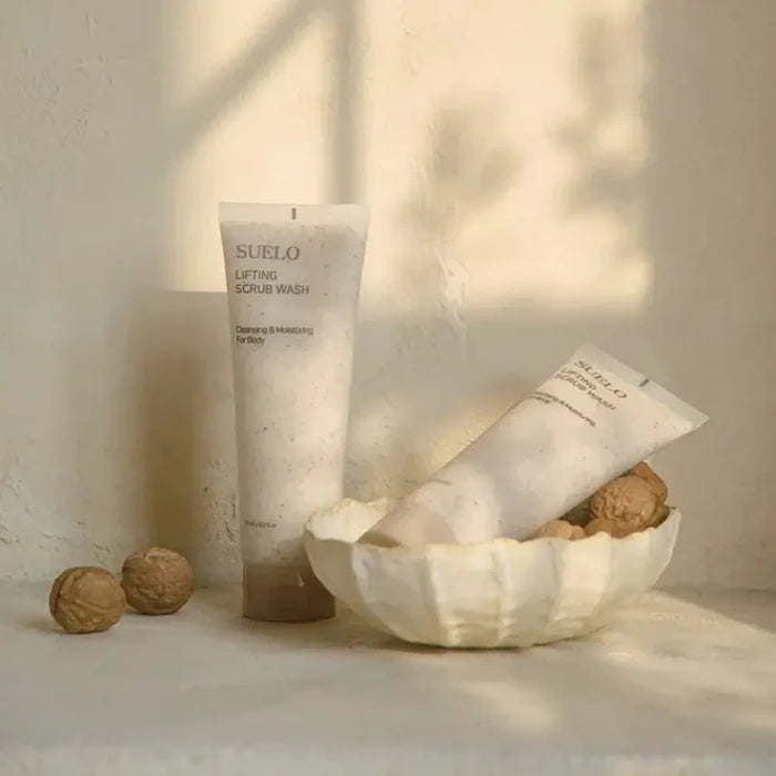 SUELO Lifting Body Scrub Wash in elegant packaging with natural elements, ideal for skin revitalization and moisturizing.