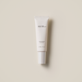 SU:M37 Microactive Sun Serum 50ml in white tube with SPF50+ protection on beige background.
