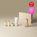 SU:M37 Secret Essence 45ml Set featuring skincare bottles and packaging against a neutral background.