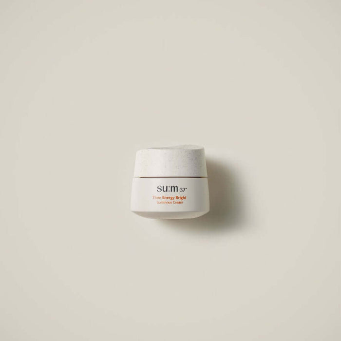 SU:M37 Time Energy Bright Luminous Cream 50ml in an elegant white jar against a neutral background.